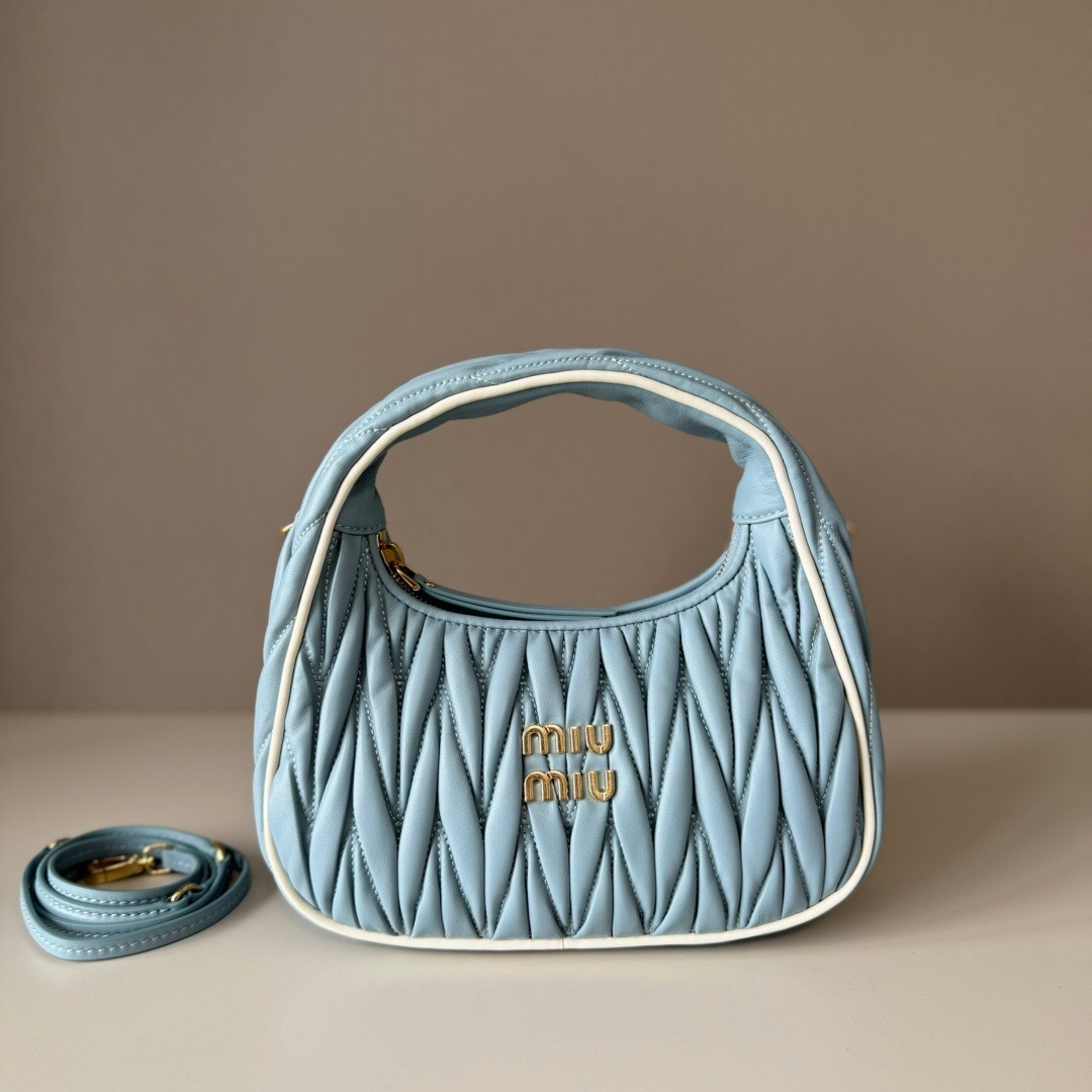Miu Miu Wander matelassé nappa leather hobo bag in a blue color