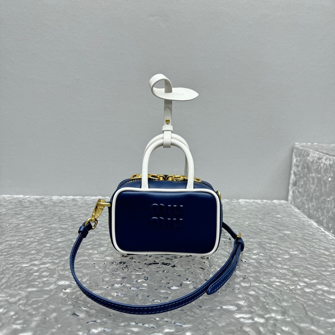 Miu Miu Beau leather micro bag in navy blue with white trim and gold-tone hardware