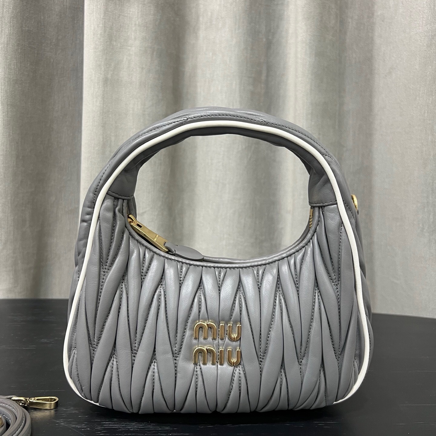 Miu Miu Wander matelasse nappa leather hobo bag in a pearl gray color