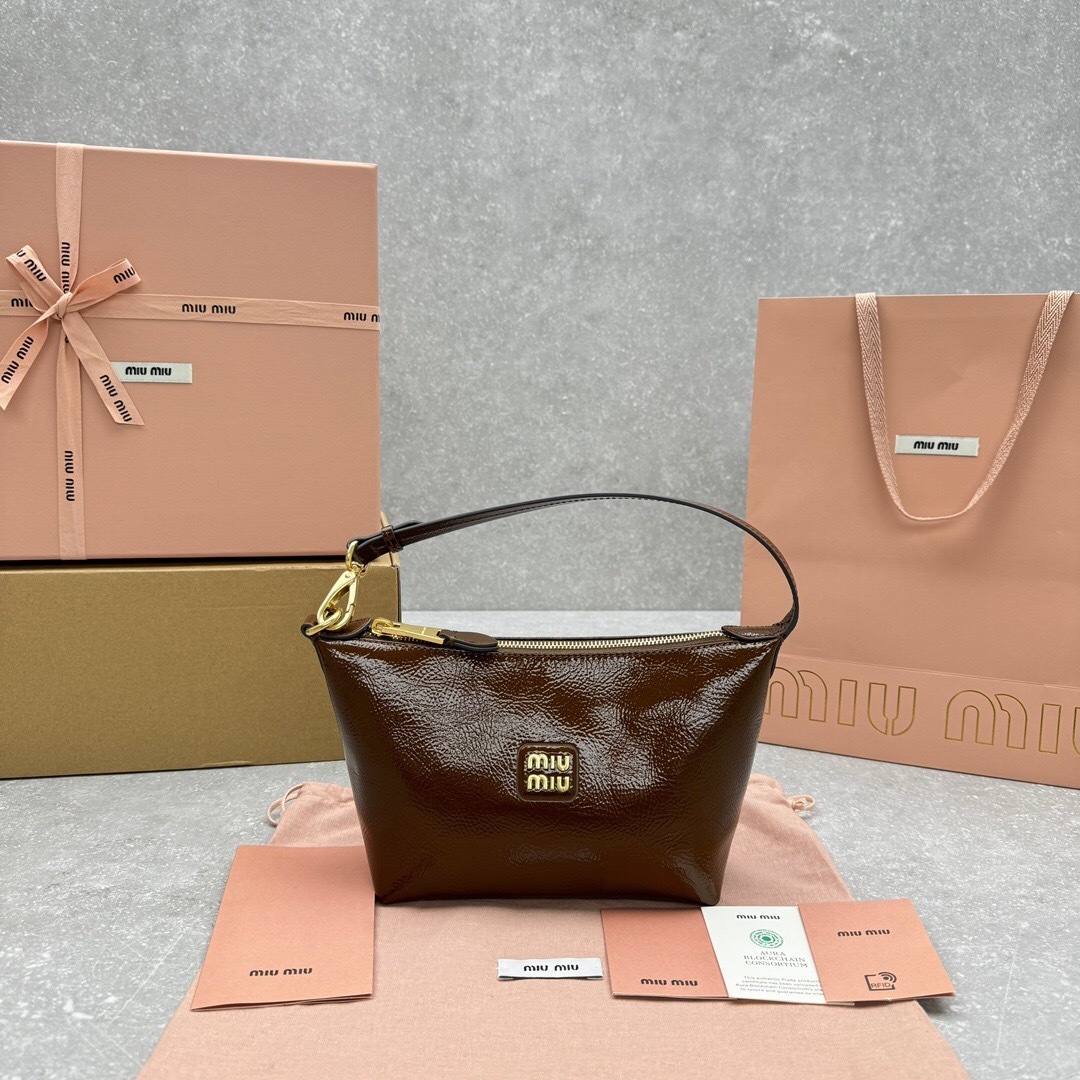 Miu Miu leather hobo bag in brown with a metal logo on the front