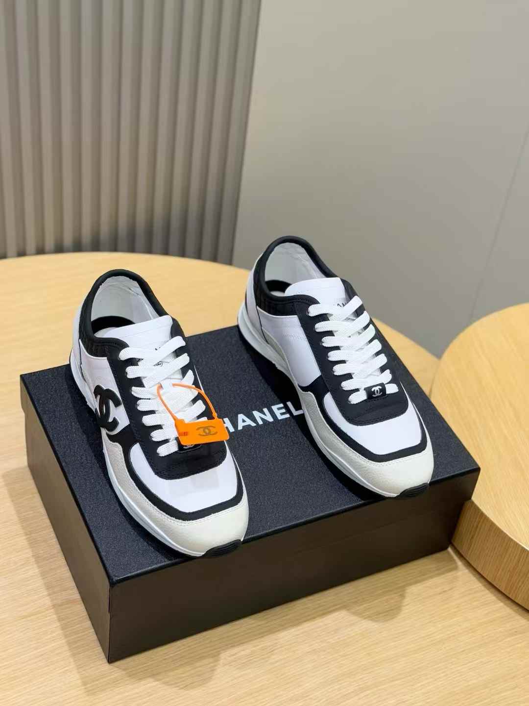Chanel CC sneakers in black and white mesh suede and leather