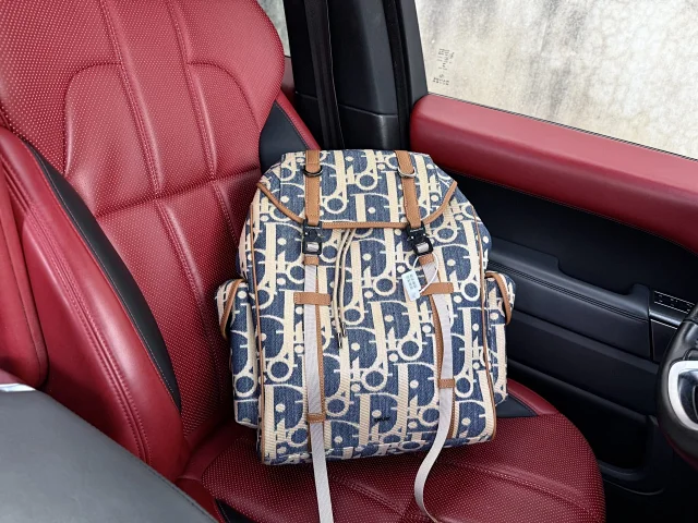 Dior Hit the Road backpack in blue and beige raffia-effect Dior Oblique denim with brown grained calfskin