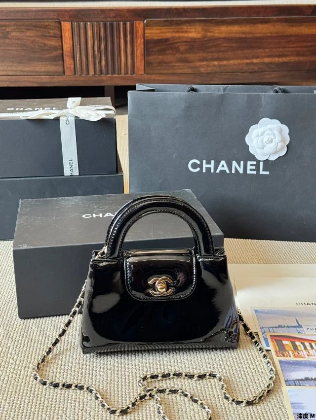 Chanel Vintage Kelly Top Handle Bag in black patent leather with gold-plated hardware