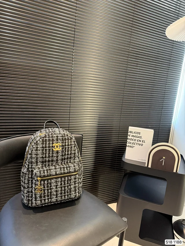 Chanel Duma Backpack in black and white tweed with gold-tone hardware