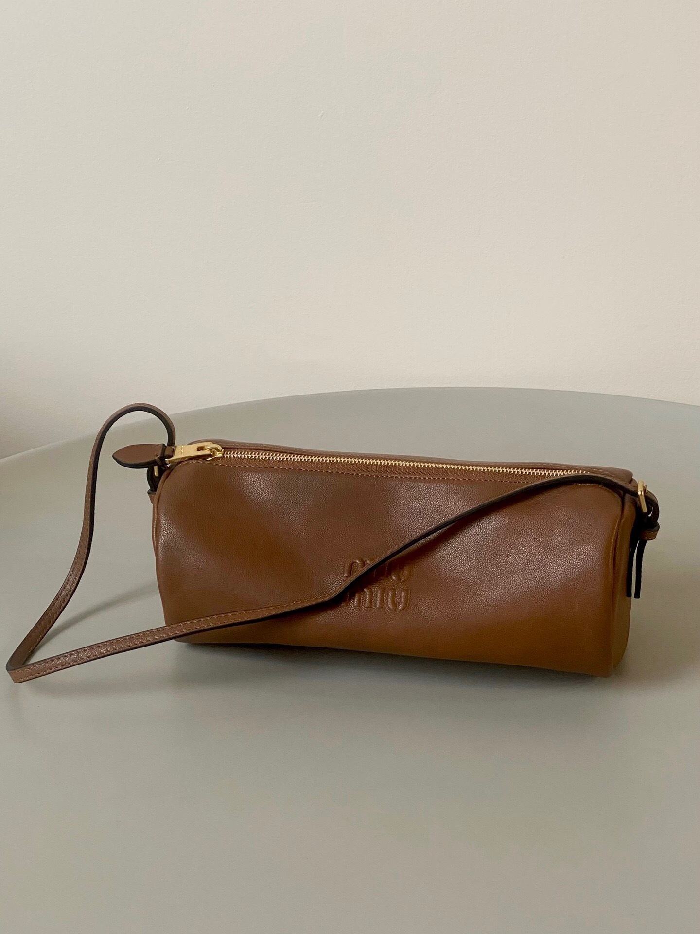 Miu Miu nappa leather pouch with an embossed logo brown