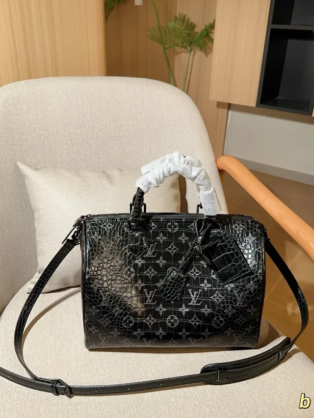 LV Monogram Keepall bag in black with a crocodile-embossed finish