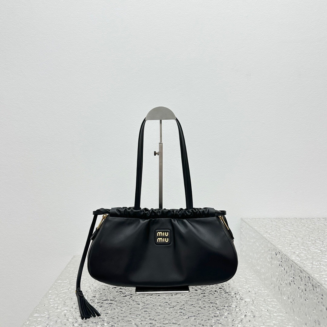 Miu Miu Aventure nappa leather bag in black.
