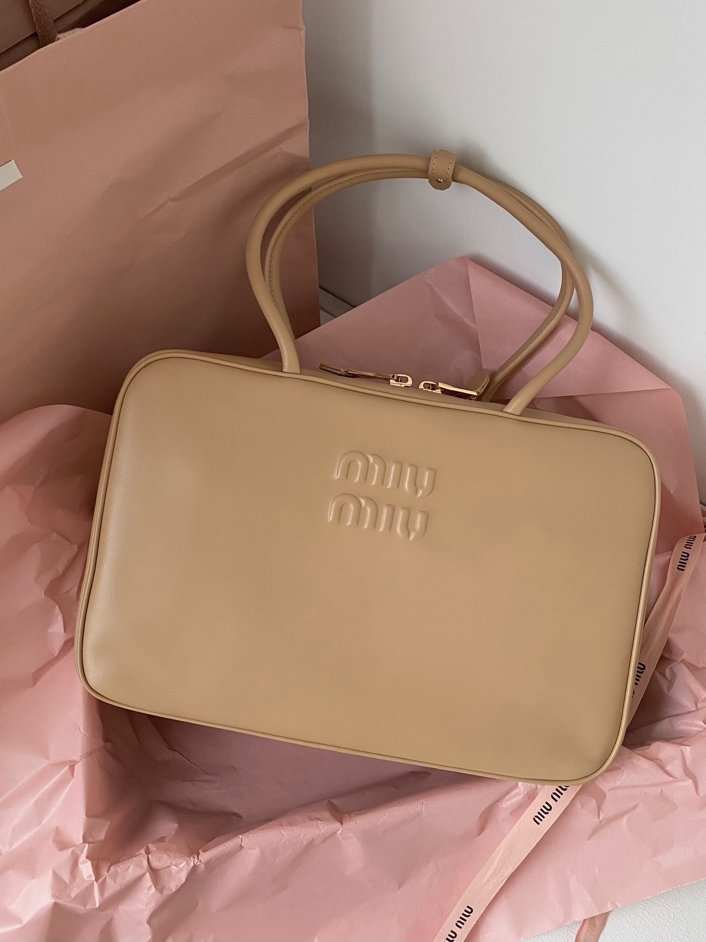 Miu Miu Beau leather top-handle bag in a camel brown color