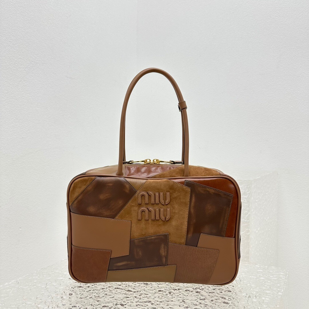 Miu Miu Beau patchwork leather top handle bag in a brown/cognac colorway