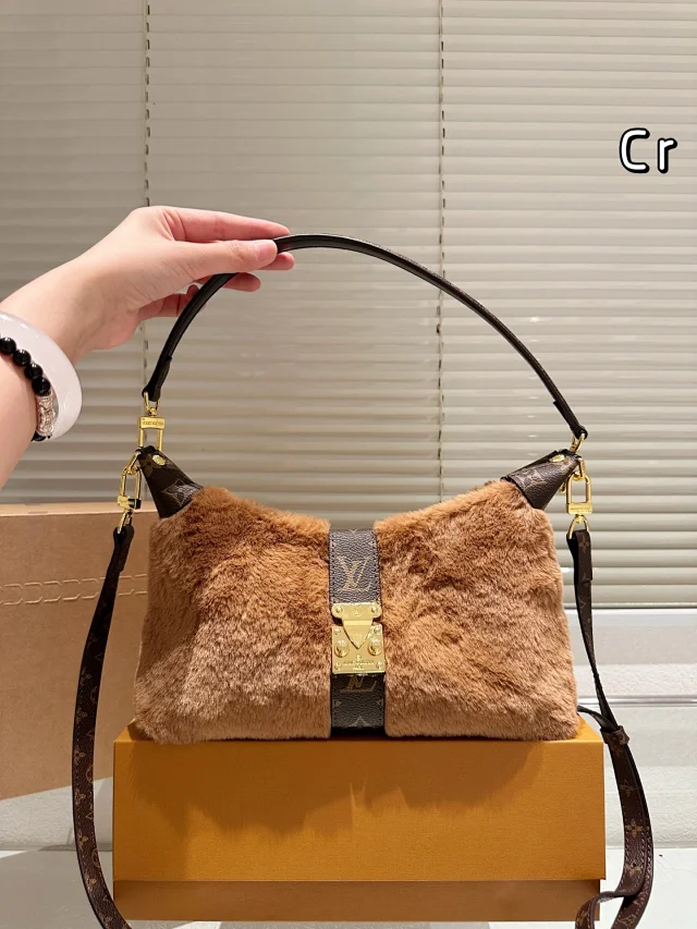 LV Pochette Mia bag with a Monogram canvas trim.