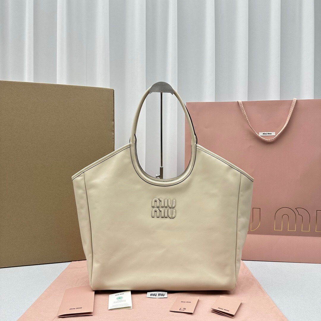 Miu Miu Ivy leather tote bag in a beige or light-colored leather