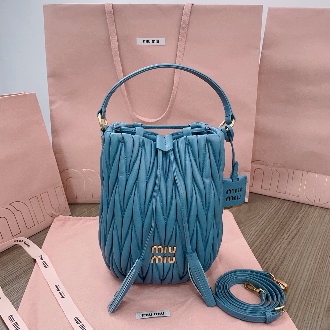 Miu Miu matelassé leather bucket bag in a light blue color