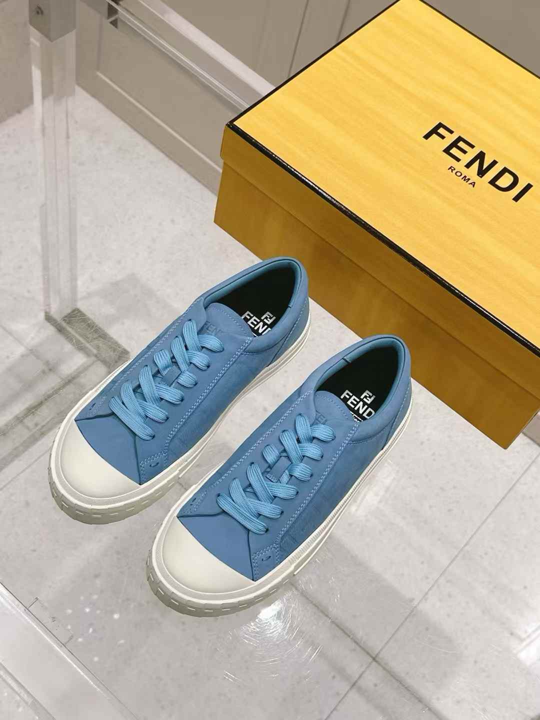 Fendi Domino sneakers in light blue nubuck leather with a hot-stamped FF motif