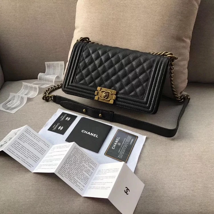 Chanel Boy quilted flap bag in black caviar leather with a gold chain