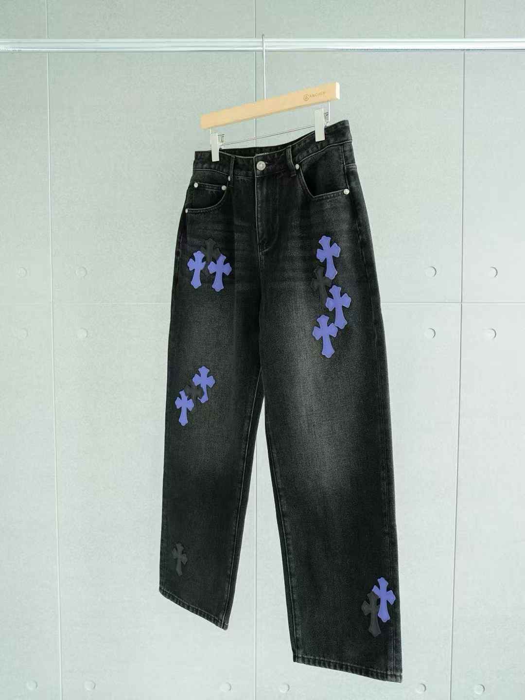 Chrome Hearts black jeans with purple cross patches