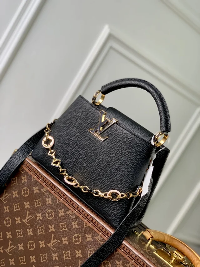 LV Capucines Mini handbag black Taurillon leather gold-toned hardware