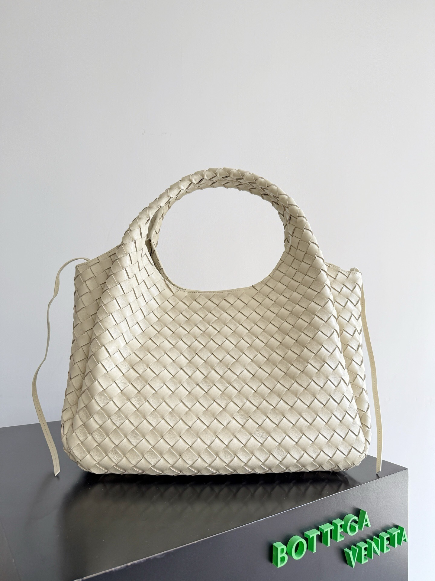 Bottega Veneta Campana bag in a light, possibly ecru or white, intrecciato leather
