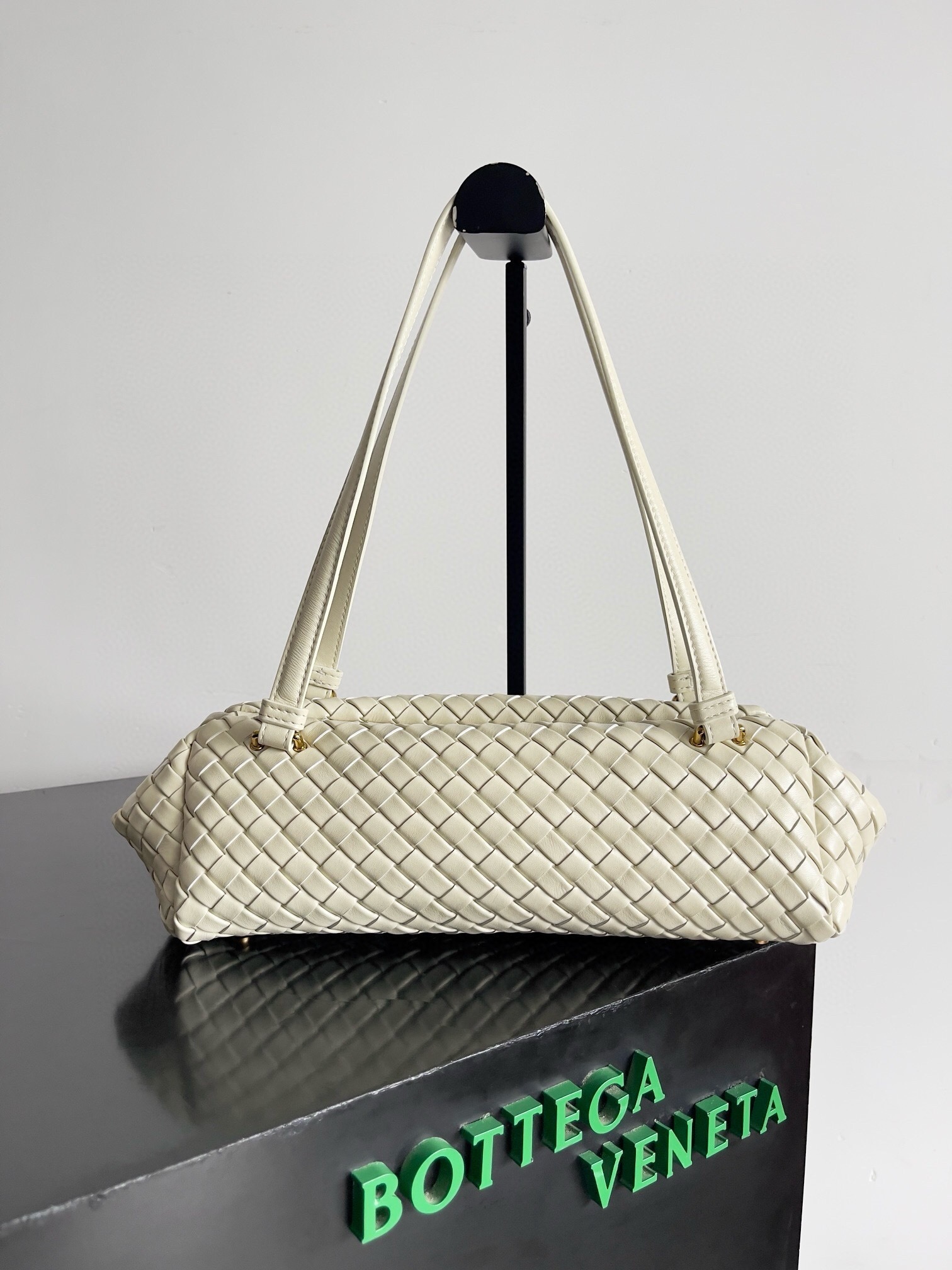 Bottega Veneta Tokyo Shoulder Bag featuring the brand's distinctive intrecciato woven pattern in white lambskin leather