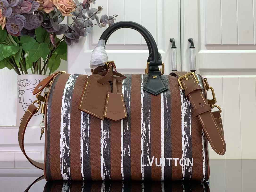LV Speedy bag in a brown and white striped design