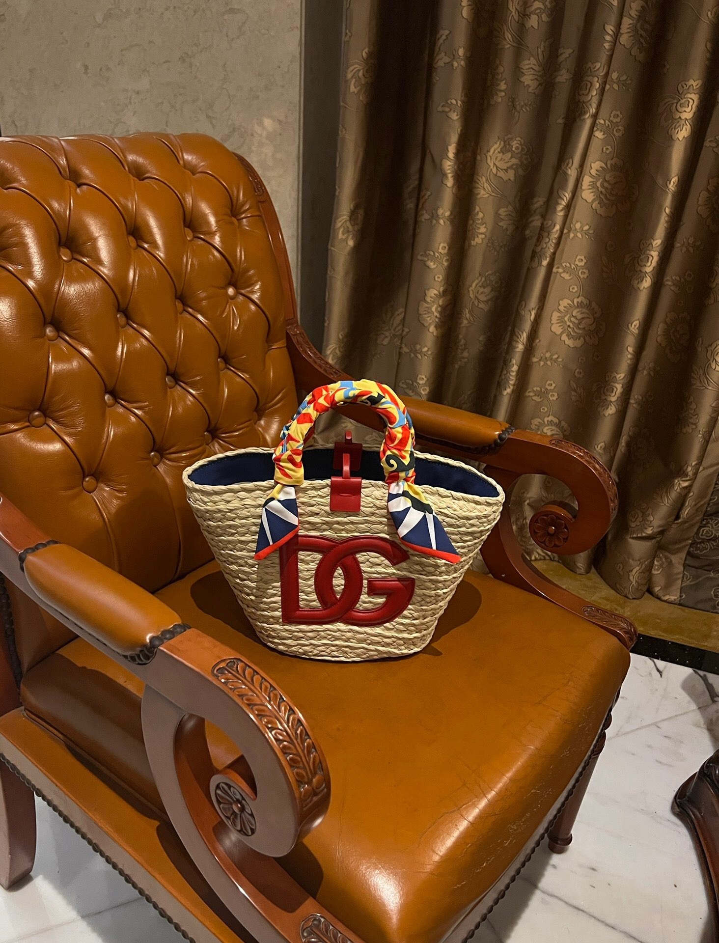 Dolce & Gabbana small Kendra tote bag made of raffia with red leather DG logo and silk twill scarf-wrapped handles