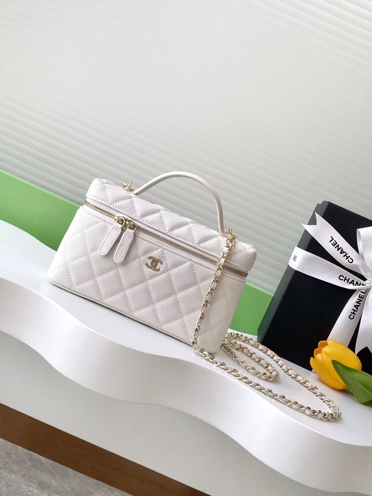 Chanel small white vanity bag with a gold chain and quilted design 19cm