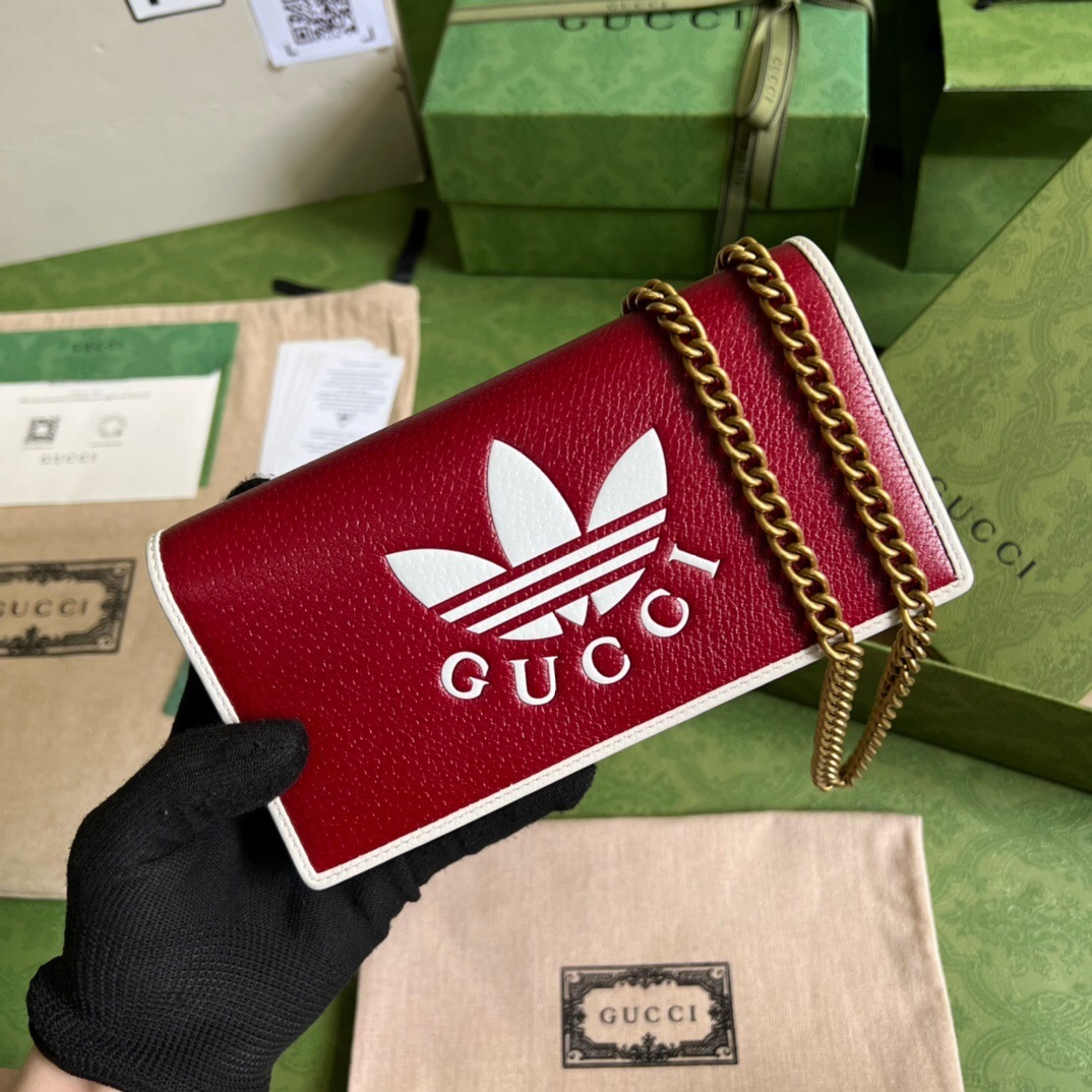 Gucci x adidas wallet with a chain