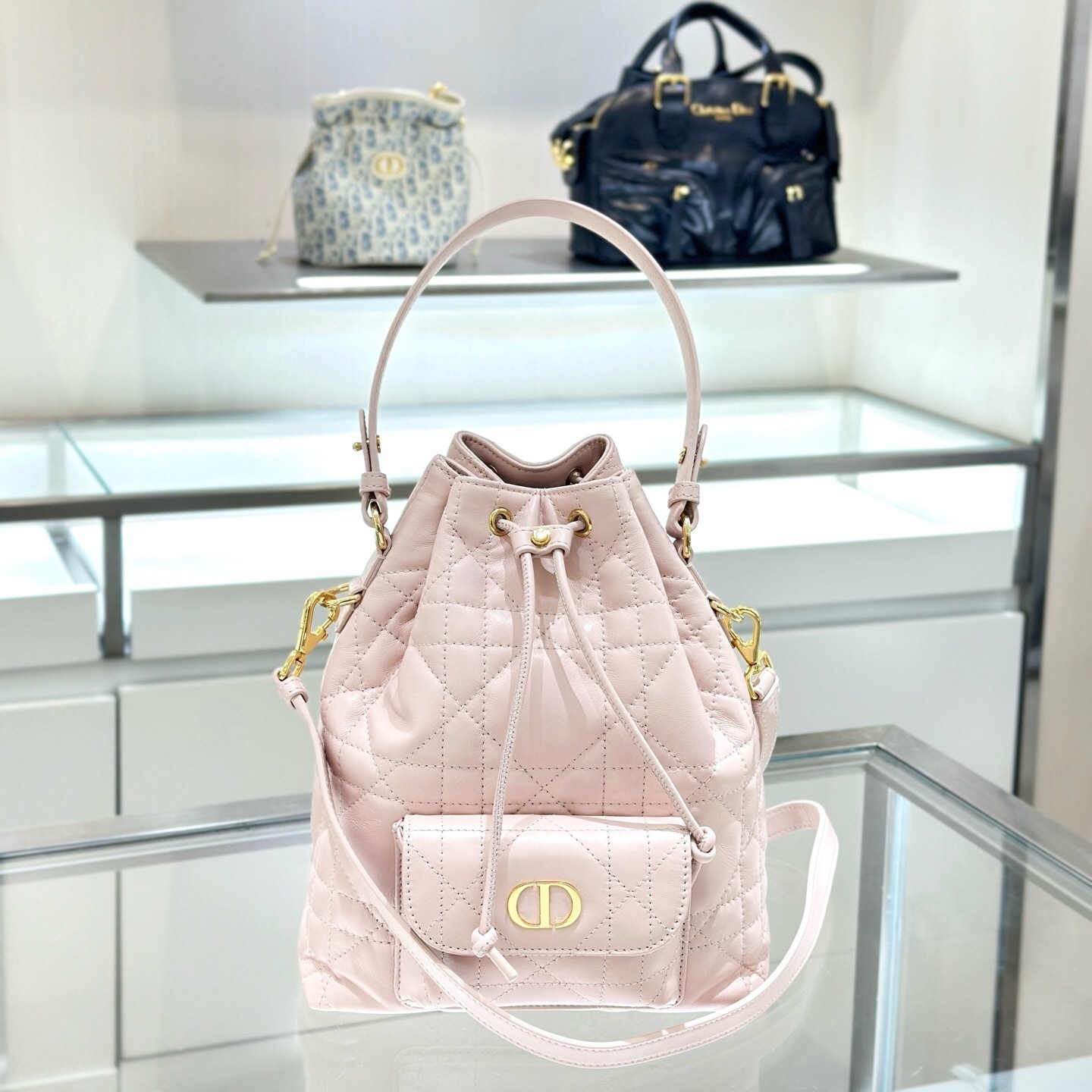 Dior Caro bucket bag in powder pink Macrocannage lambskin
