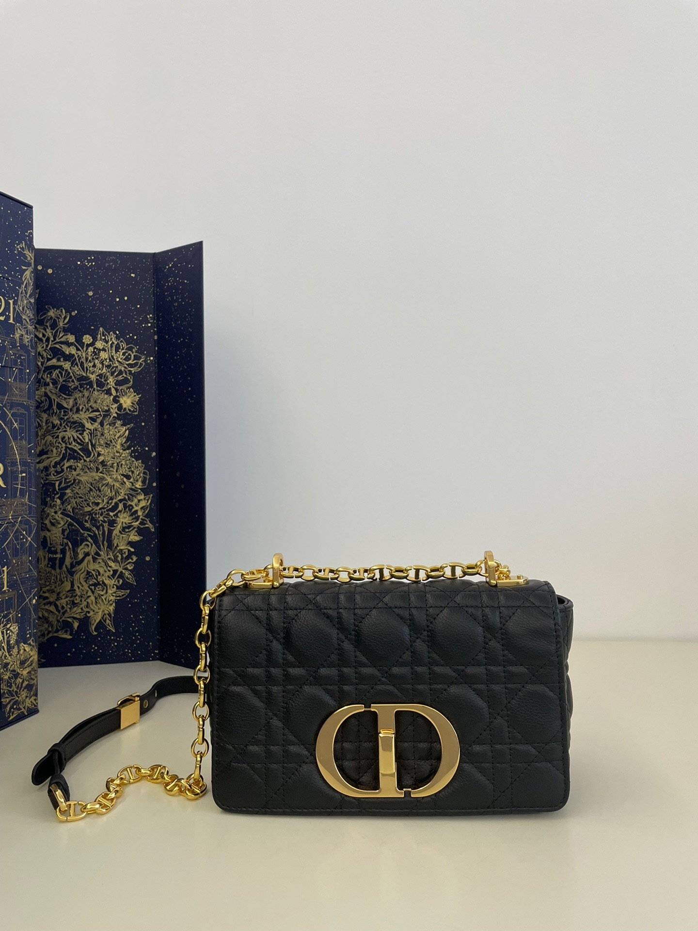 Dior Small Caro Bag black supple Cannage calfskin gold-finish metal CD twist clasp