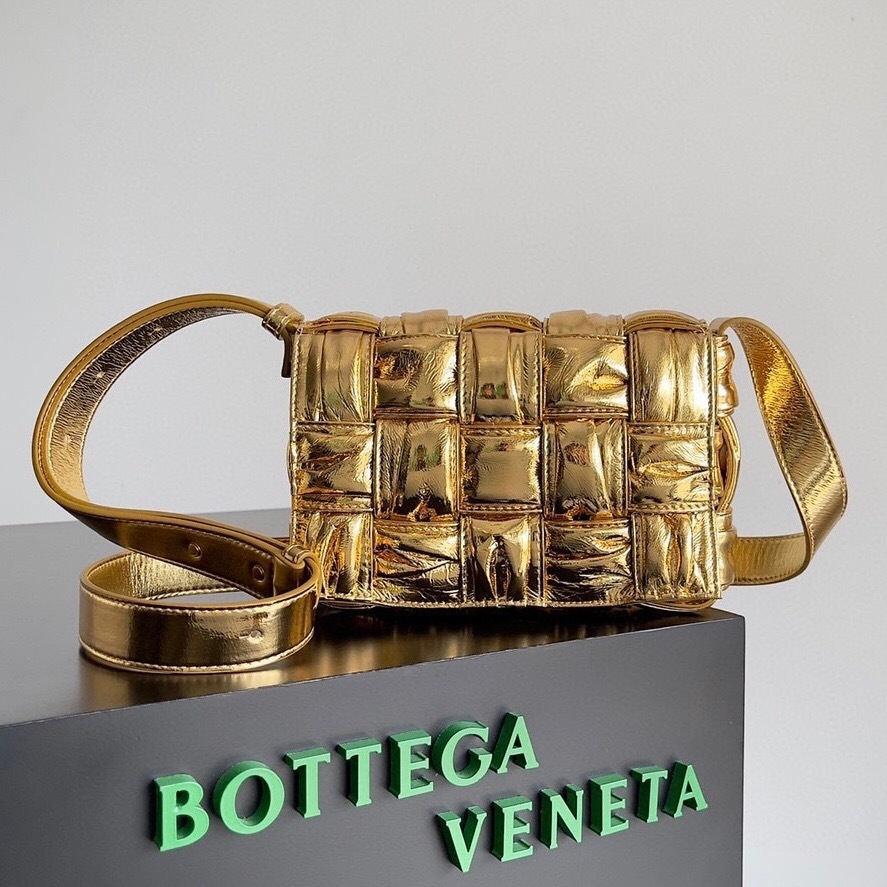 Bottega Veneta Padded Cassette Crossbody Bag in gold, made from lambskin leather