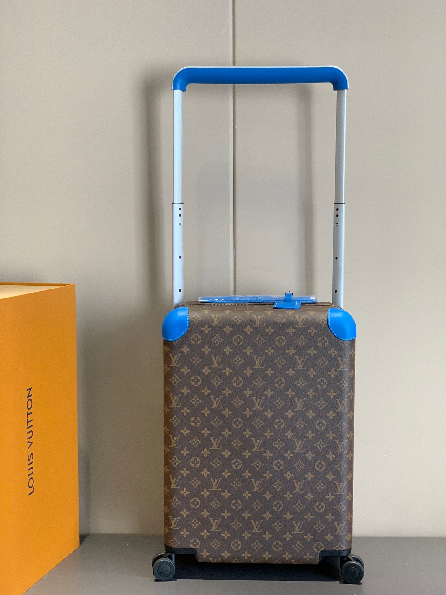 LV Horizon 55 rolling suitcase in Monogram Macassar canvas with blue leather trim