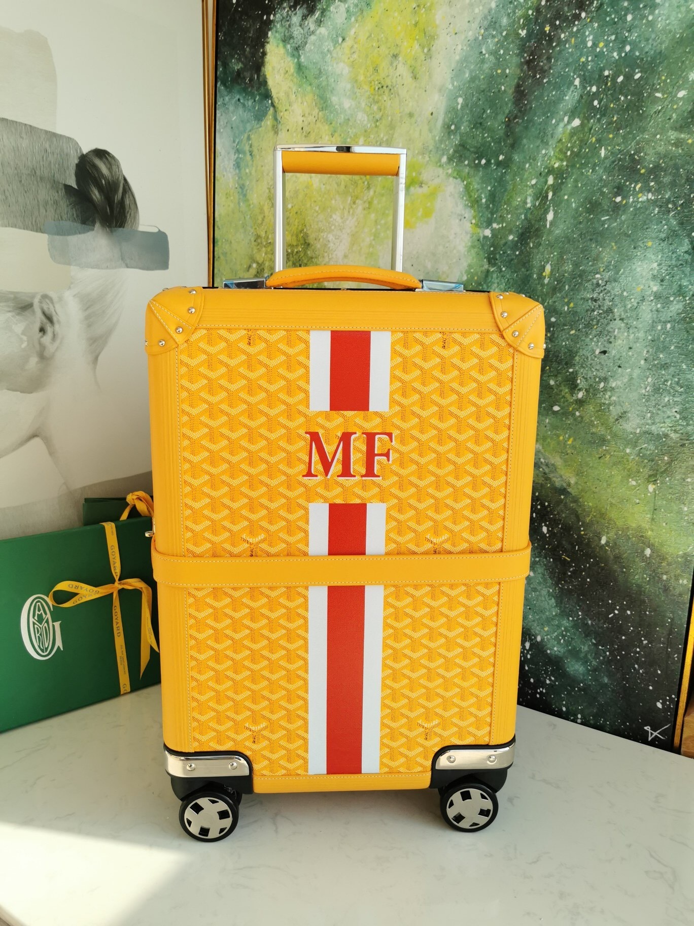 Goyard Bourget PM trolley case with a custom "MF" monogram and stripes