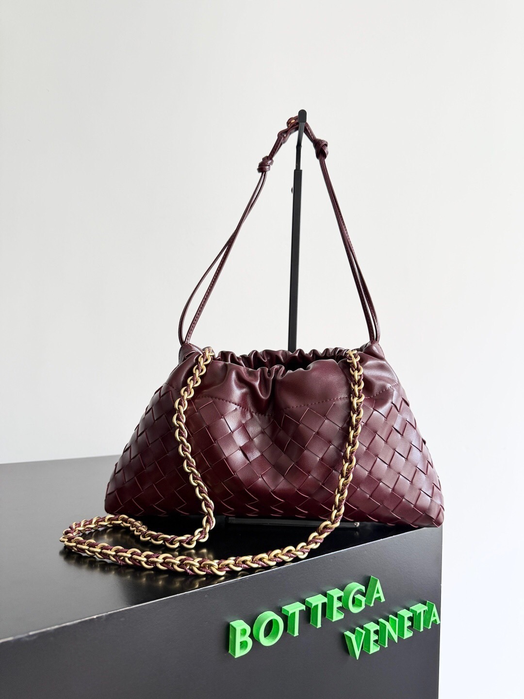 Bottega Veneta Chain Pouch bag in a deep red or burgundy intrecciato leather