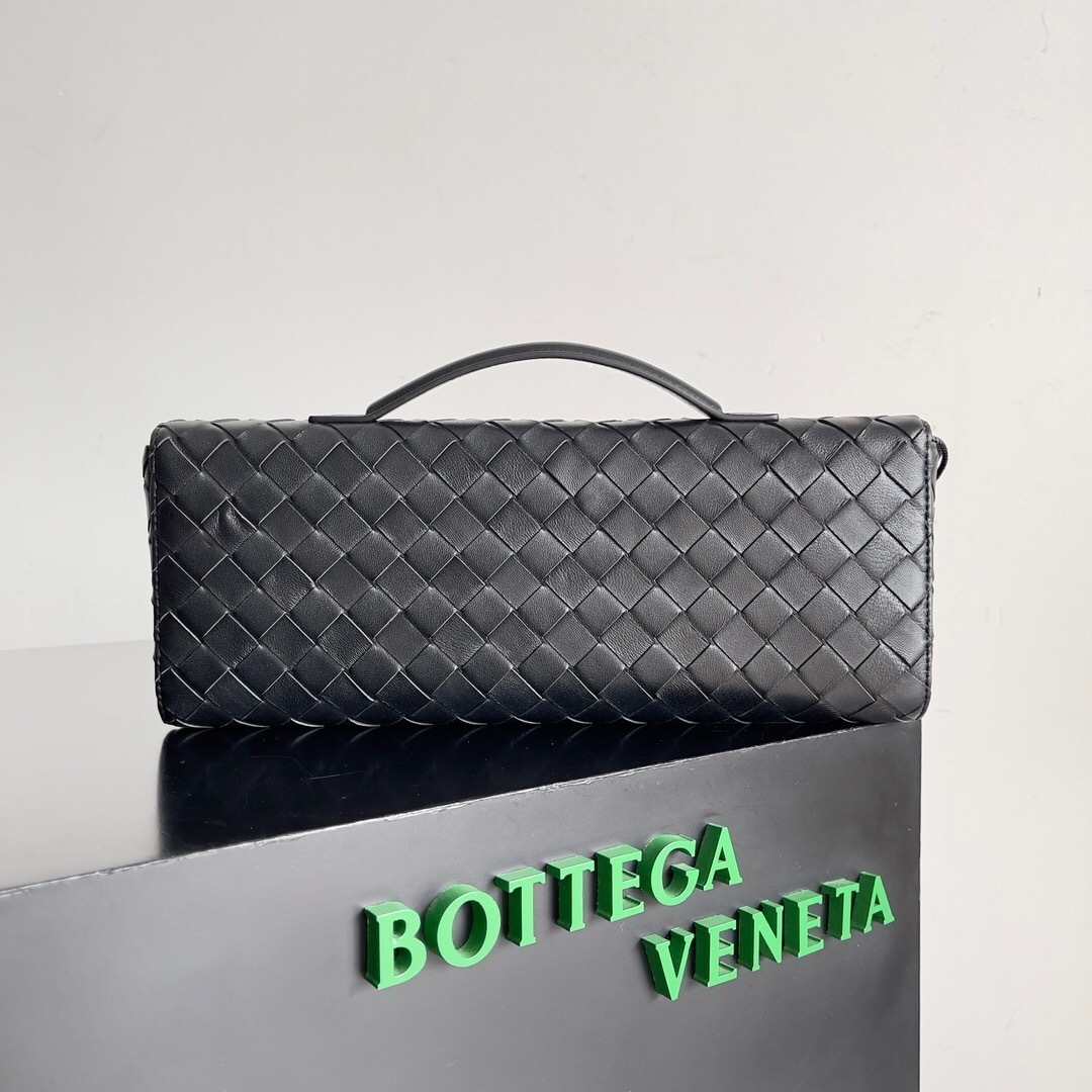 Bottega Veneta Andiamo clutch in Intrecciato leather with a signature knot closure.