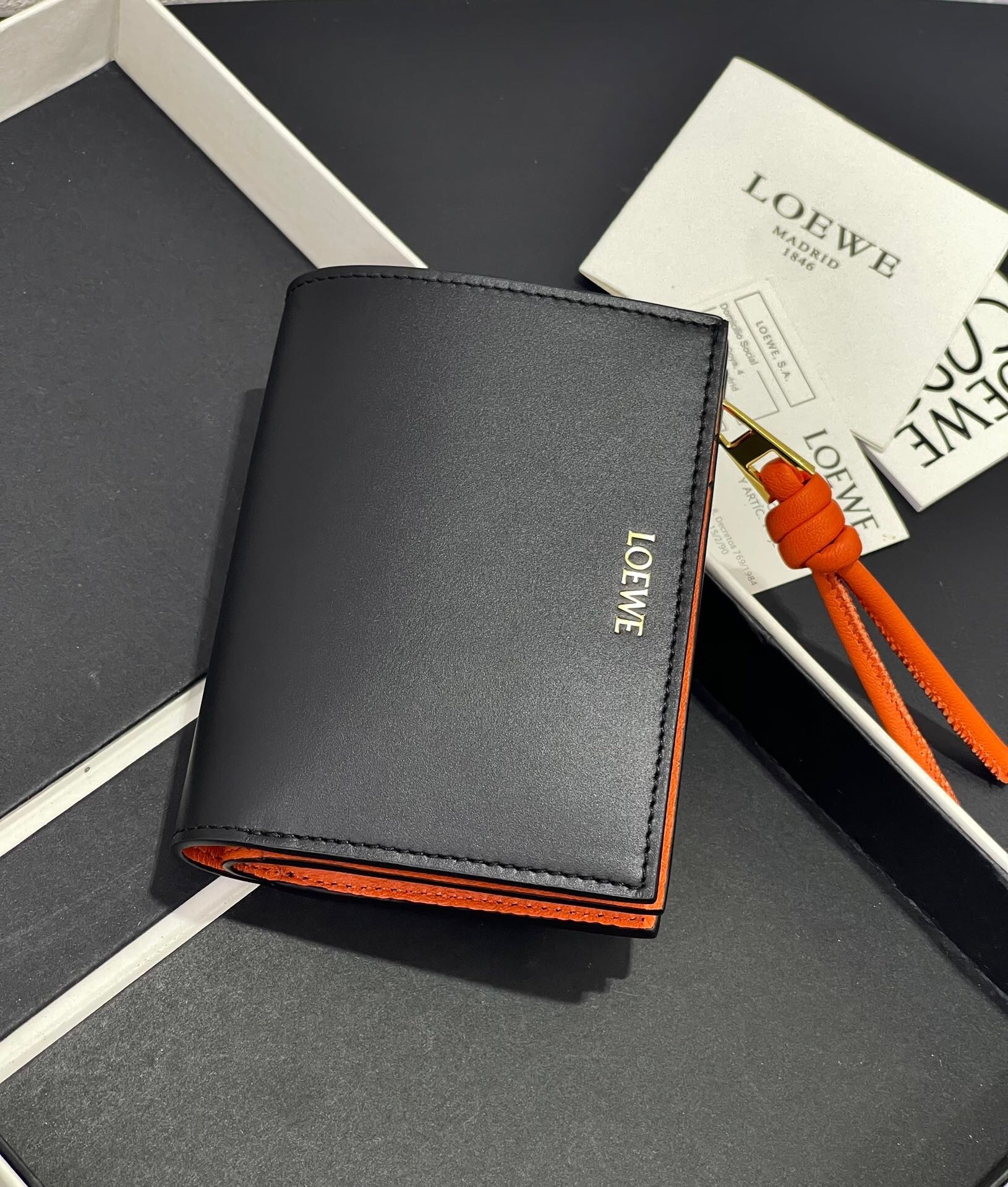 Loewe Knot Compact Zip Around Wallet shiny nappa calfskin contrasting orange interior