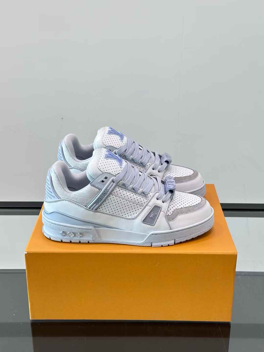 LV LV Trainer sneakers in a white and pastel two-tone color scheme
