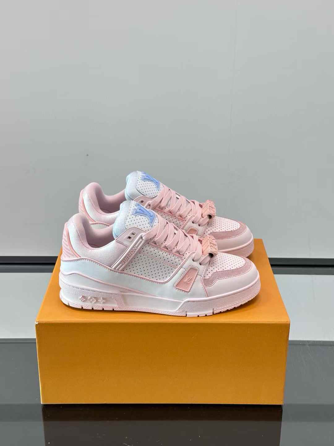 LV Trainer Low Top Sneakers in rose pink and white leather