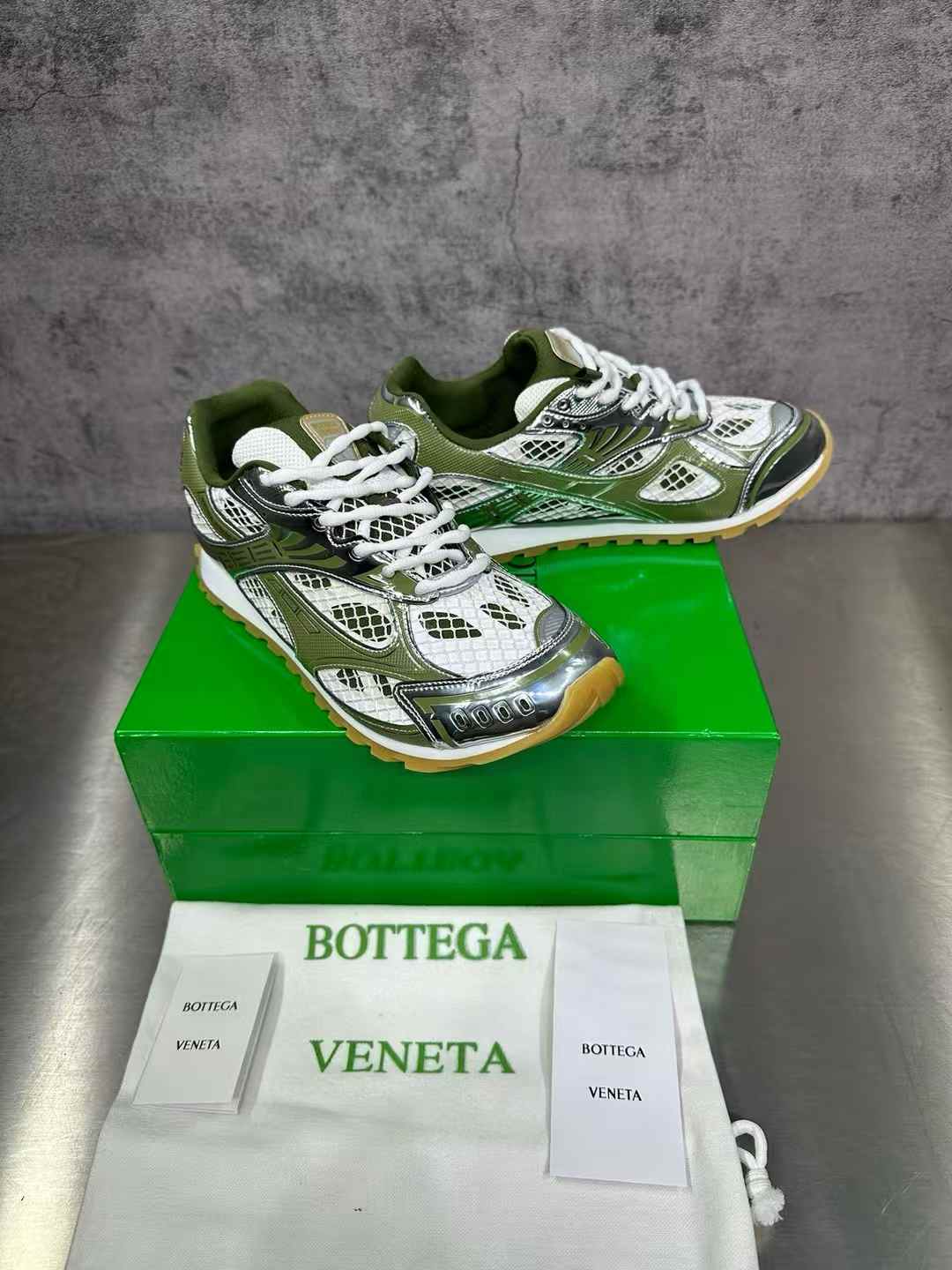 Bottega Veneta Orbit sneakers in a green and silver colorway