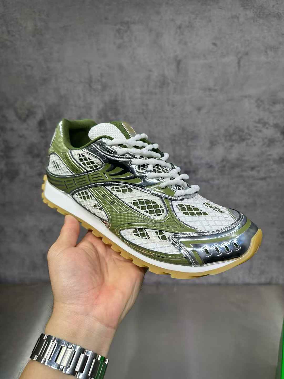 Bottega Veneta Orbit sneakers in a green and silver colorway