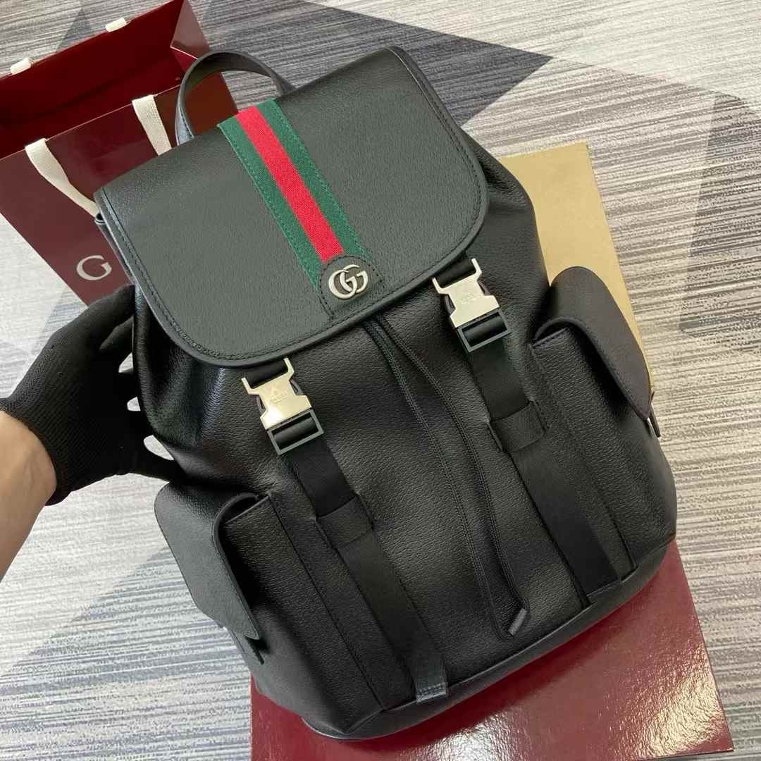 Gucci backpack with the brand's signature red and green Web stripe and Interlocking G logo.