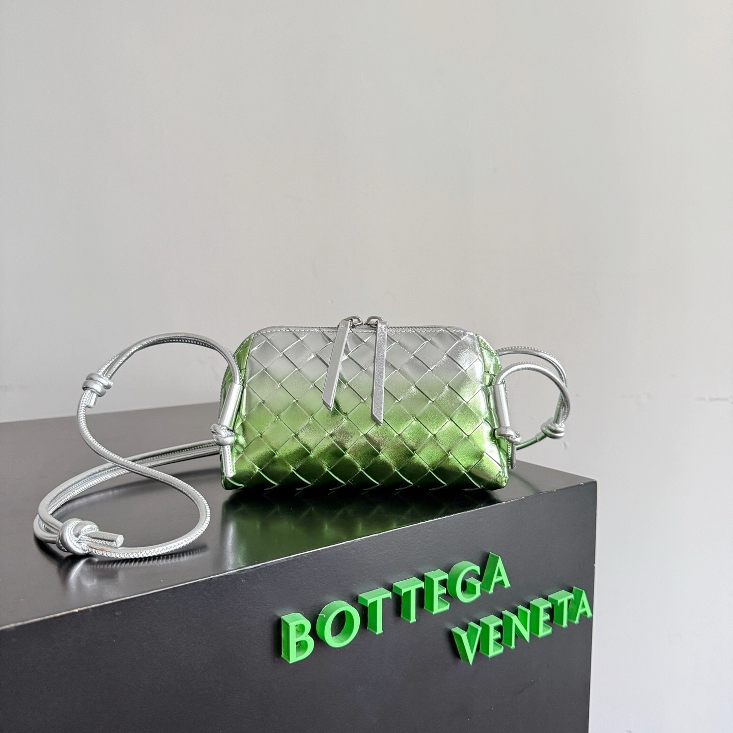 Bottega Veneta Concert Pouch in silver and fresh mint laminated Intrecciato leather