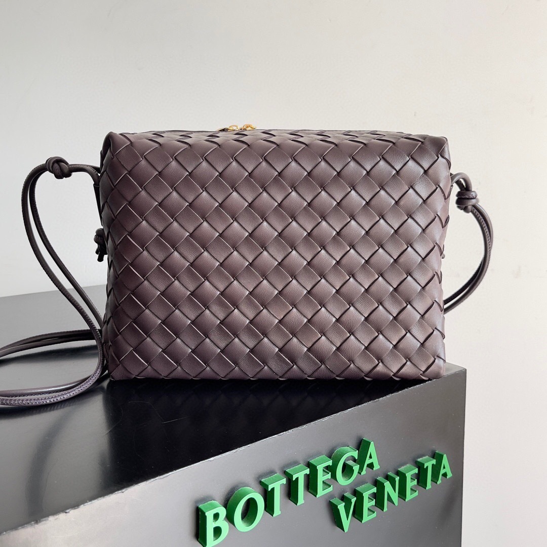 Bottega Veneta Mini Loop camera bag in an Intrecciato-pattern weave, crafted from supple lambskin leather with gold-tone hardware