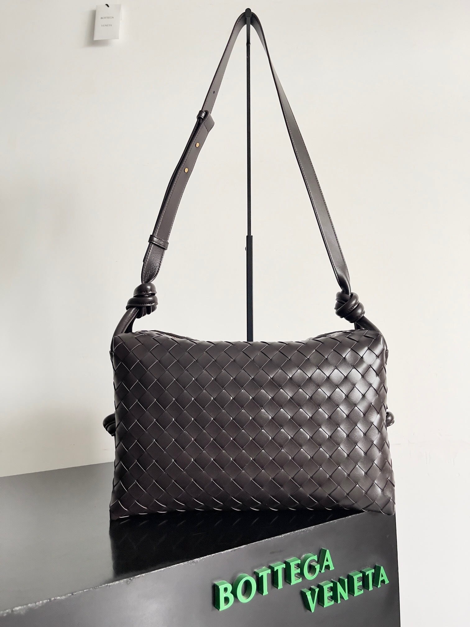 Bottega Veneta Loop intrecciato leather weekend bag in a dark brown or fondant color