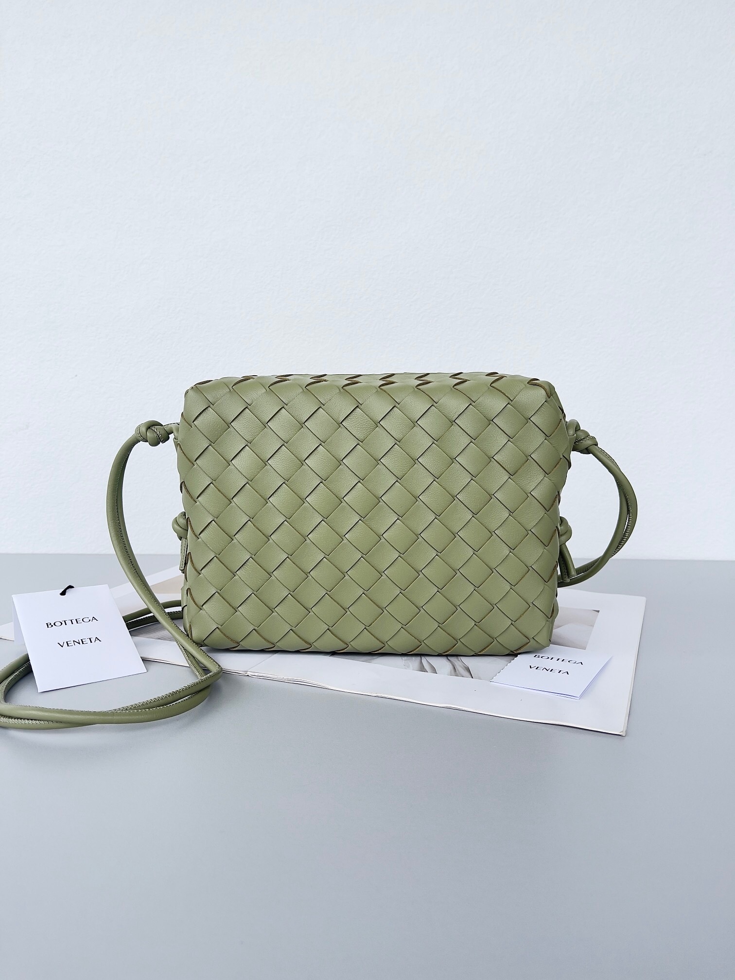 Bottega Veneta Mini Loop Intrecciato leather camera bag in a green color