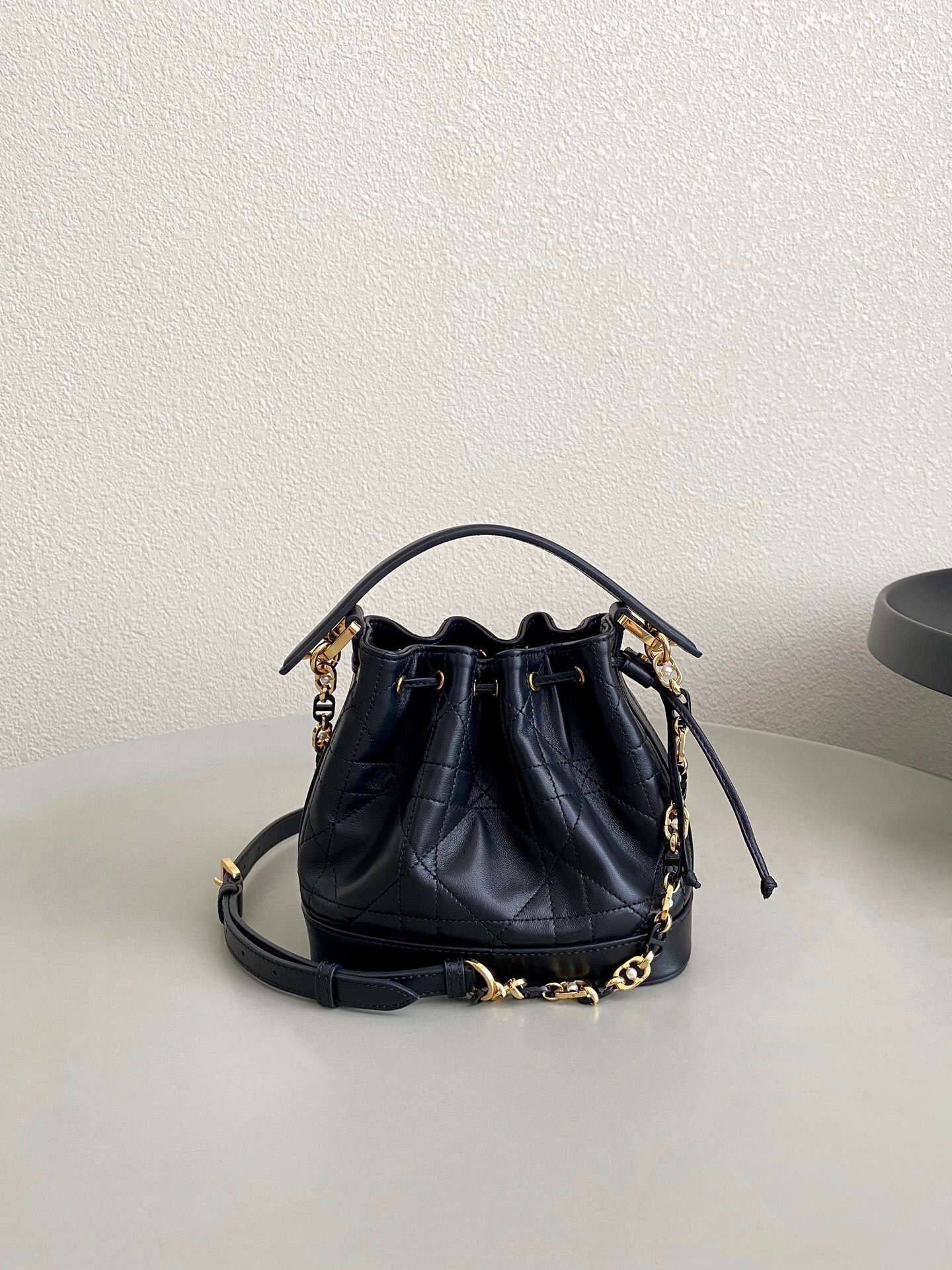Dior Jolie bucket bag in lambskin and calfskin with Macrocannage stitching