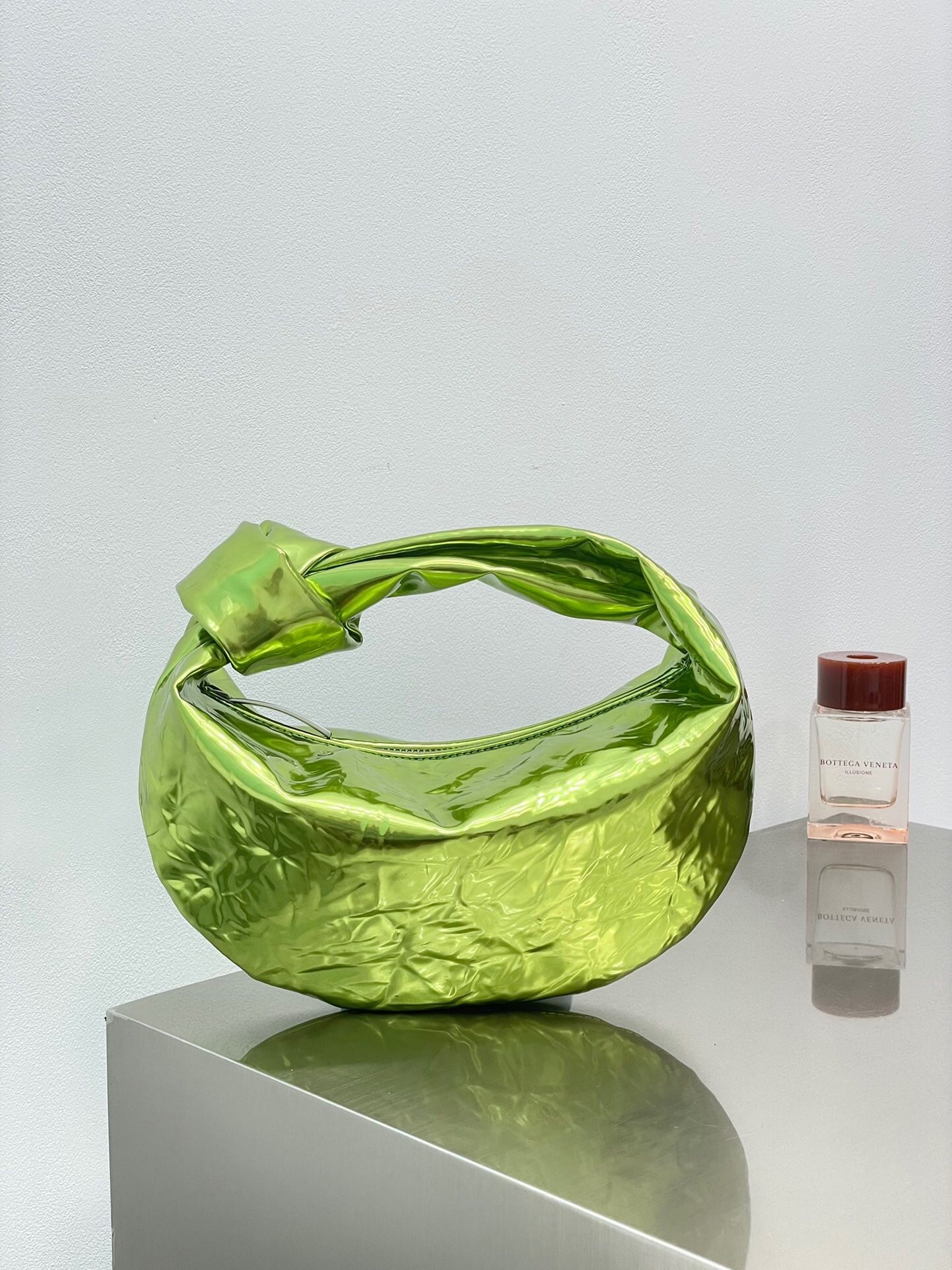 Bottega Veneta Mini Jodie bag in a metallic green color