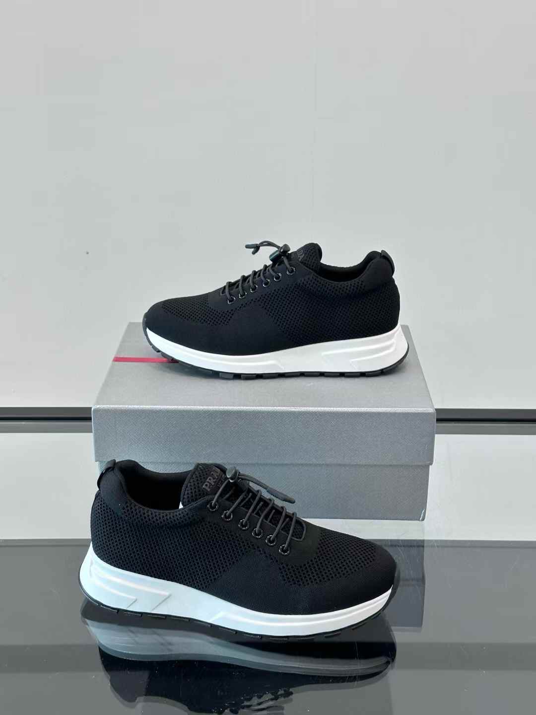 Prada black mesh lace-up sneaker with a white sole