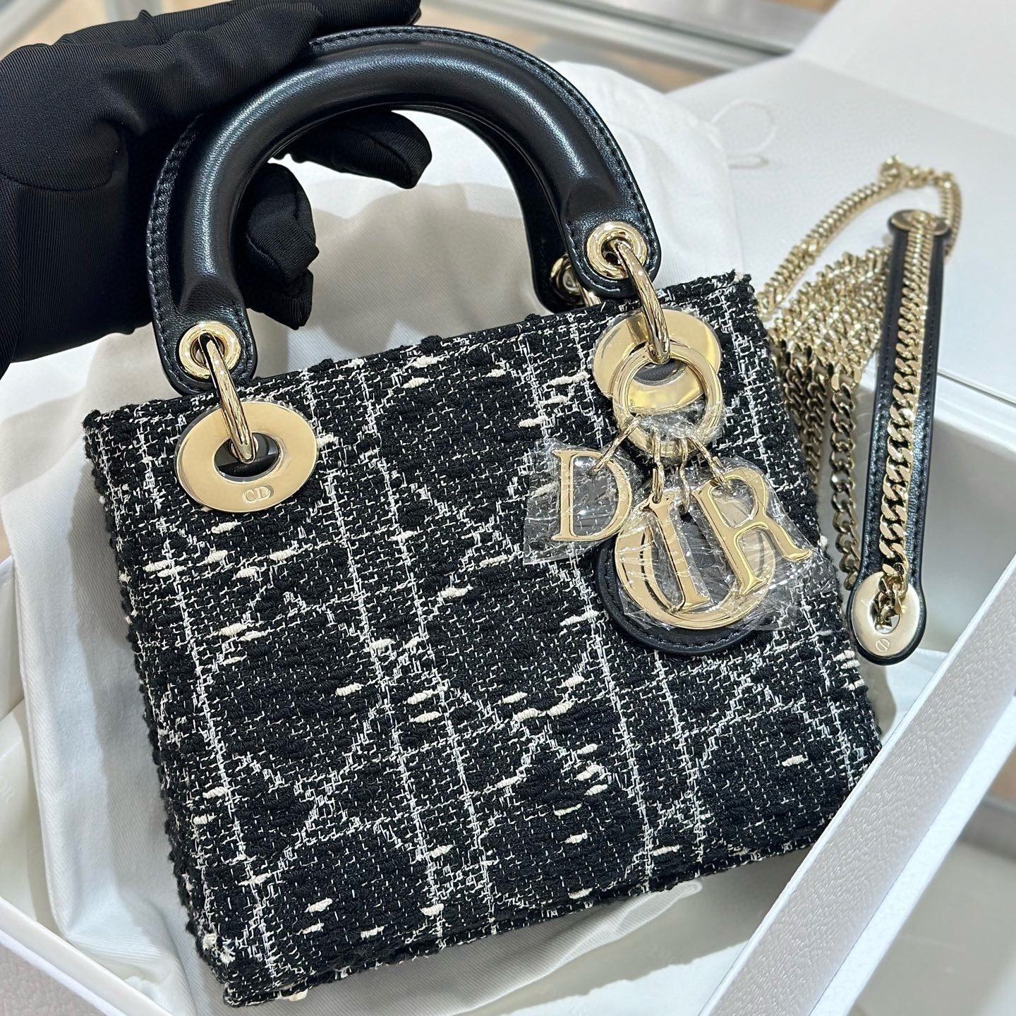 Dior Mini Lady Dior bag in black tweed with gold-tone metallic thread in a Cannage motif