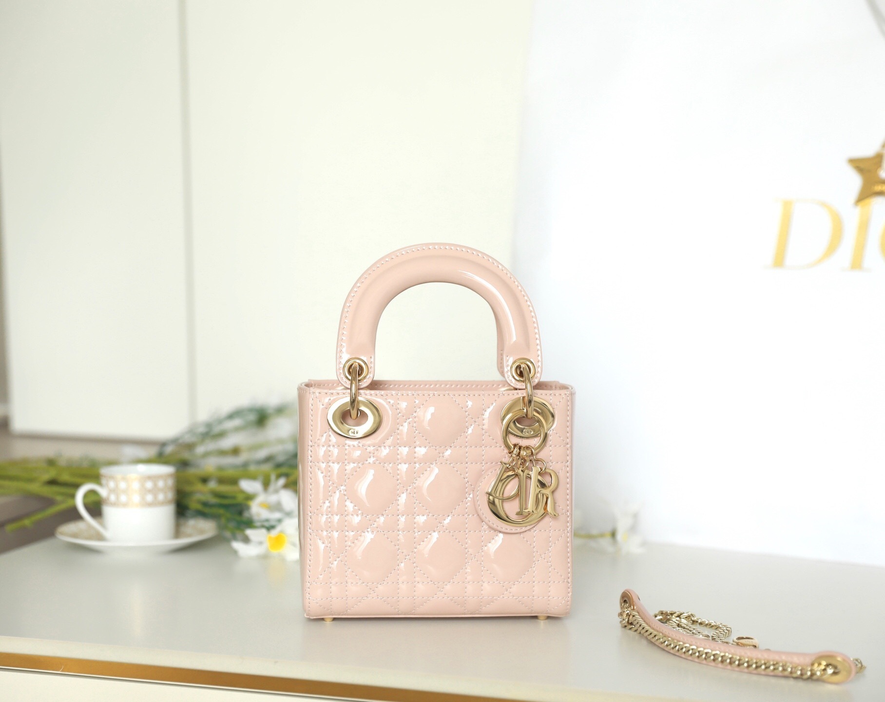 Dior Mini Lady Dior bag in blush pink patent lambskin with Cannage stitching and gold-finish metal