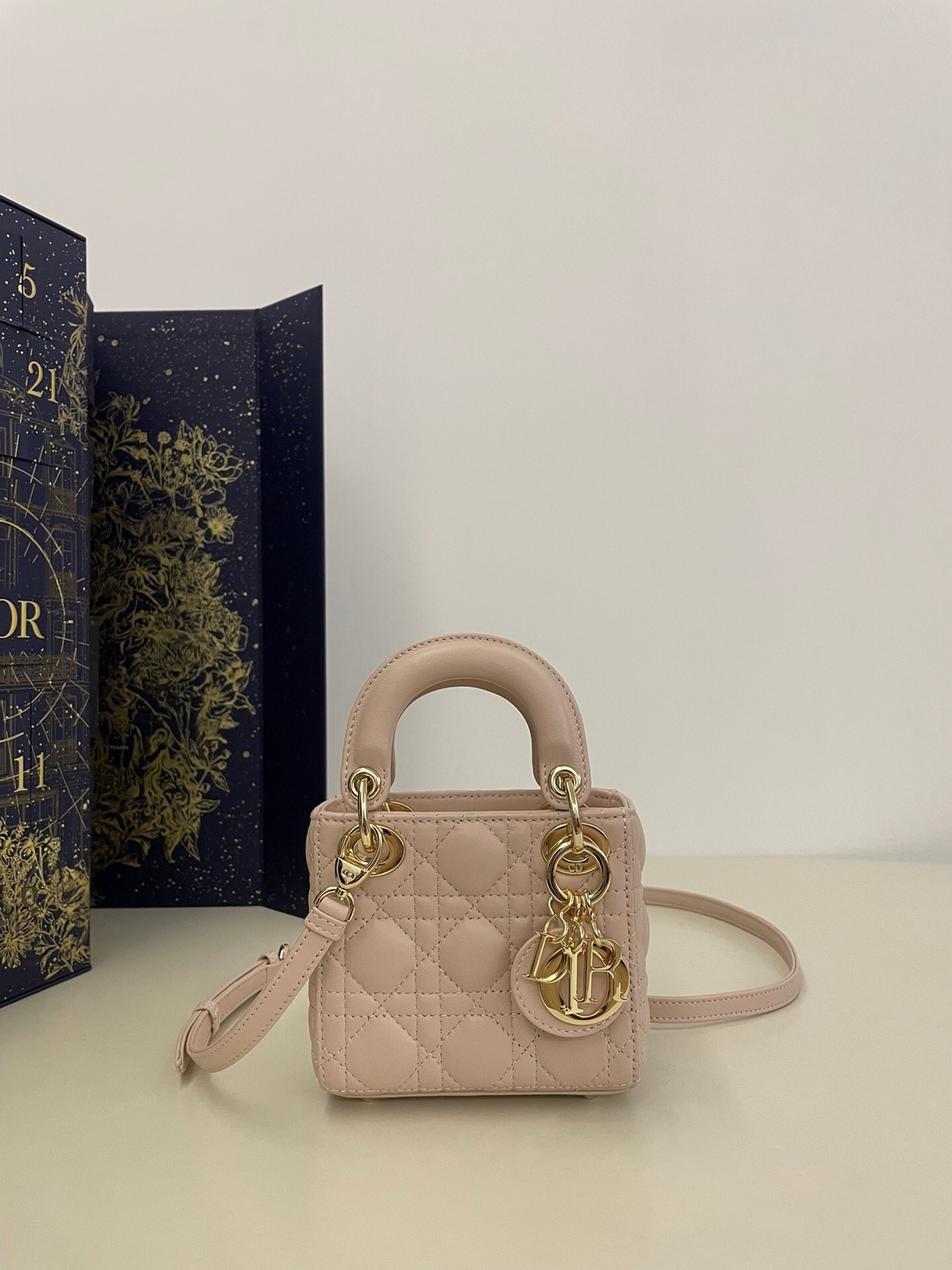 Dior Lady Dior Micro bag in powder pink Cannage lambskin with pale gold-finish metal