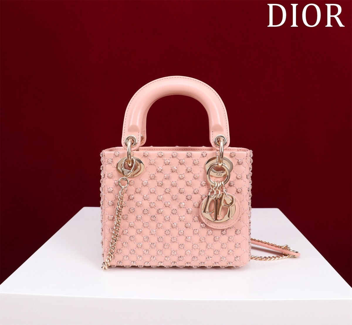 Christian Dior Mini Lady Dior bag in platinum-tone metallic cannage lambskin with beaded embroidery.